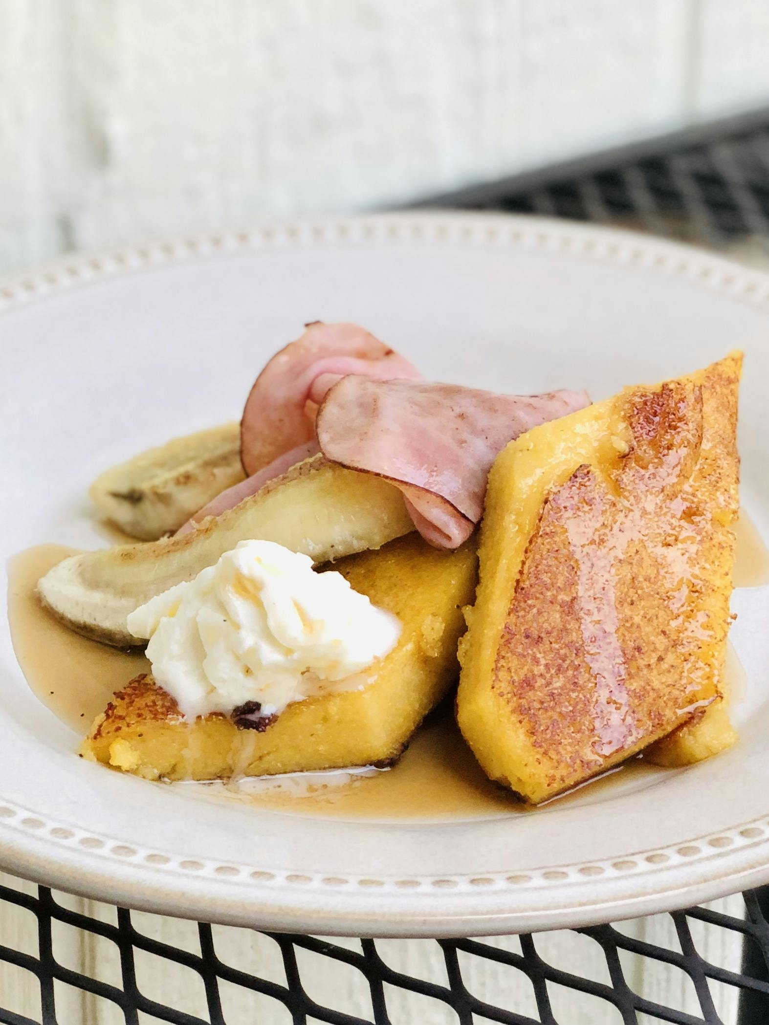 Honeyed griddled cornmeal mush with ham, banana and butter
